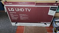 Original box for LG 43UP70 43-inch UHD TV showing model and key features.
