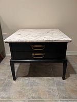 Front view of end table showing marble top and two drawers