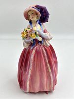 Front view of the pink-gowned figurine holding a bouquet