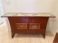 Front elevation showing full credenza, glass top, door panels and legs