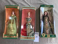 Three collectible Barbie dolls in original shaped window boxes, labeled Legends of Ireland series: Faerie Queen, The Spellbound Lover, Princess of Ireland.
