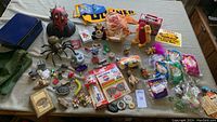 Full lot of vintage collectibles including McDonald's and Barbie Happy Meal toys, metal items, and Star Wars bust.