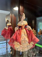 Side view of the Royal Doulton Southern Belle figurine showing detailed sculpting of the dress and figure.