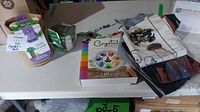 Table display of all items including grow kits, crystal set, fabric panels, and light catchers.