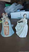 Both Goebel Flower Madonna and Royal Doulton Donna figurines shown side by side