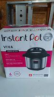 Box of Instant Pot Viva multi-use pressure cooker showing product image, branding, and features like 9-in-1 cooking, 6 quart capacity.