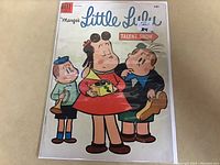 Photo of the front cover of the 1954 Little Lulu comic book #77 inside protective plastic.