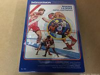 Front side of sealed Boxing La Boxe Intellivision video game box showing artwork and title.