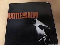 Front cover of U2 Battle and Hum gatefold double LP showing album title and band image.