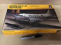 Box image showing the Douglas C-47 Skytrain model kit with aircraft illustration and branding.