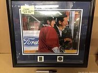 Full shot of Wayne Gretzky and his father in framed photo including framing and matting with autograph and authenticity stickers.