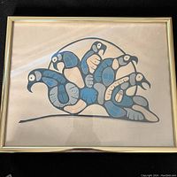 Front image of framed First Nations signed print 'Loons Nocturnal Call' by Goyce Kakegamik showing the stylized loons motif; signs of fading visible on the print.