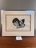 Framed artwork, front view showing full image, mat, and frame on a shelf.