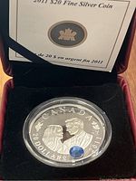 Front image of the 2011 Canadian $20 fine silver coin featuring Prince William and Catherine, showing the blue gemstone and inscriptions.
