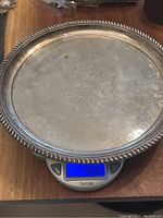 Top view of round tray on digital scale showing weight of 488 g