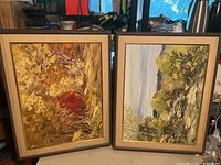 Both framed paintings side by side, showing overall composition and framing