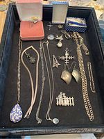 Tray overview showing all assorted silver-tone pieces