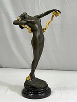 Front full view of the bronze sculpture on base