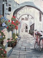 Close-up image showing details of the Mediterranean courtyard print, including flowers on stone steps, archways, and part of the bicycle.