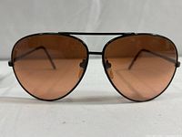 Front view of the driver glasses showing brown tinted lenses and black metal frame