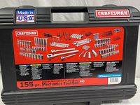 Closed case with label showing 155-piece Craftsman mechanics tool set contents and Made in USA sticker.