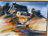 Close-up of the print showing the cabin on a hill with earthy tones and loose brushstrokes