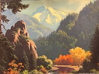 Detailed close-up showing the vibrant fall colors, rocky formations, pine trees, and snow-capped mountain peak in the background.