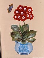 Close-up photo of the oil painting depicting a red auricula flower plant in a blue pot with detailed leaves against a plain background.