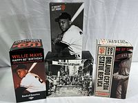 Four boxed San Francisco Giants collectible figures featuring Willie Mays and Orlando Cepeda.