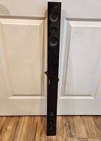 Full front view of the Samsung sound bar speaker showing all speaker drivers and branding.