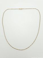 Full length of thin yellow gold box chain necklace