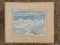 Full view of framed painting on floor showing composition and frame.