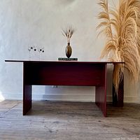 Front view in closed console configuration with decorative items on top