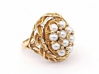 Cluster of ten seed pearls side of ring, angled view