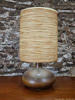 Full front view of lamp showing base and shade