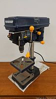 Front view of Mastercraft drill press showing base, table, column and head