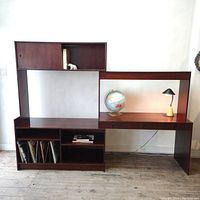 Front view of extended unit configured as desk with upper hutch, lower credenza and record storage