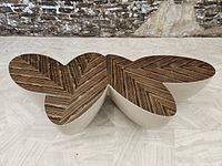 Top view of specimen showing full biomorphic shape, zebra wood veneer top and off white base.