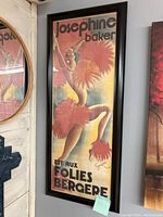 Full view of the framed Josephine Baker Folies Bergere poster showing the full standing pose with feather costume and color gradient background.