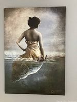 Full view of the canvas print showing the woman with a shell lower body and a dreamlike background.