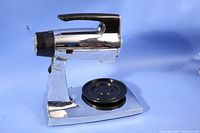 Vintage Sunbeam chrome food mixer on its base with black rubber ring.