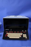 Front view of the Westinghouse serial CRT video display terminal showing large CRT screen and keyboard layout with beige and red keys.
