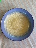 Top view of the Portmeirion serving bowl showing the full circular shape and crystalline starfire pattern with blue and beige color gradient.