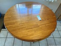Overhead view of round teak table top