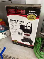 Photo of the boxed Red Lion RL-SS50V sump pump showing front box graphics and branding.