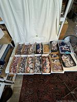 Overview of multiple bins filled with assorted vintage campaign buttons