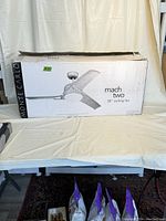 Packaged Monte Carlo Mach Two 38" Ceiling Fan box showing brand and model info.