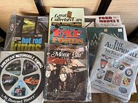 Shows the lot of 8 hardcover automotive books including titles focused on collector cars, hot rods, racing, and Ford Model T.