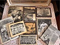 Nine vintage black and white baseball photographs mounted on wood, laid on a table showing various players, teams, and stadium scenes