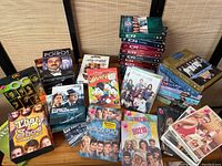 Photo showing a collection of TV series DVD box sets and cases, including That '70s Show, Poirot, Streets of San Francisco, DuckTales, Melrose Place, and 90210.